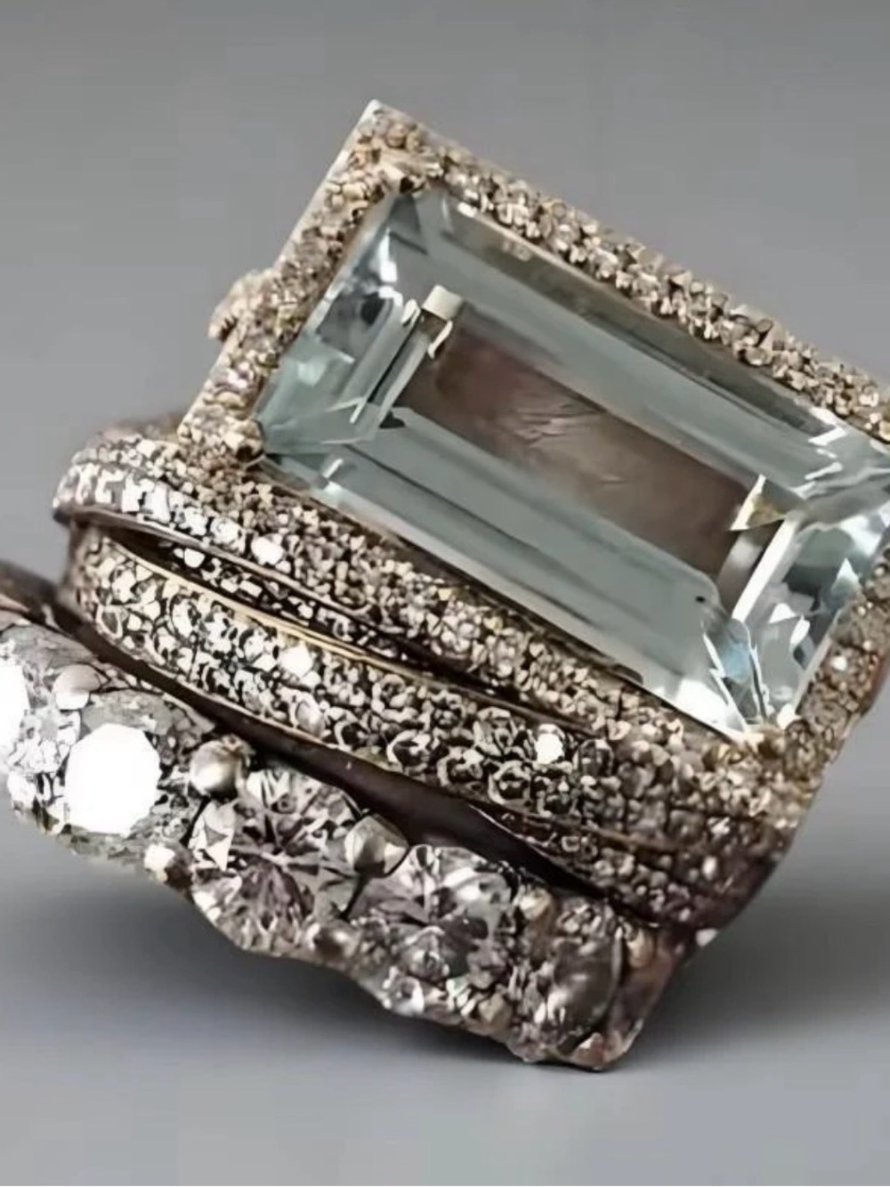 Silver Ring with Light Blue Emerald-Cut Center Stone and Pavé Accents